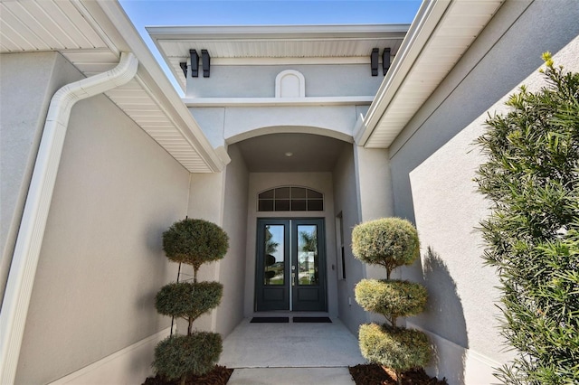5226 Lake Venice Dr, Wimauma, FL 33598 - view of exterior entry featuring stucco siding and french doors