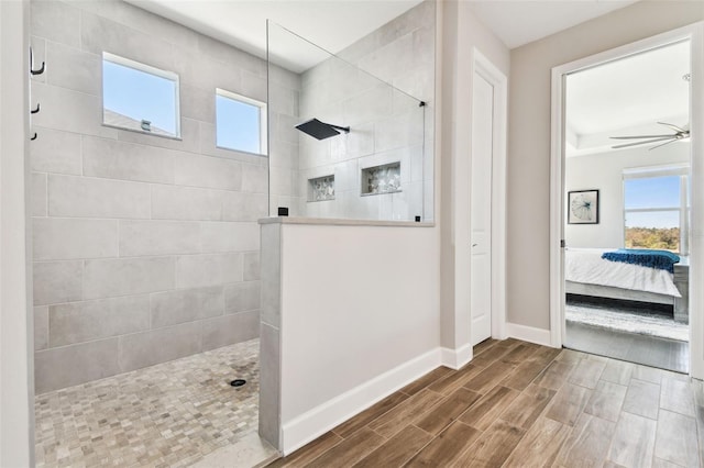 5226 Lake Venice Dr, Wimauma, FL 33598 - bathroom featuring plenty of natural light, a walk in shower, ensuite bathroom, and wood tiled floor