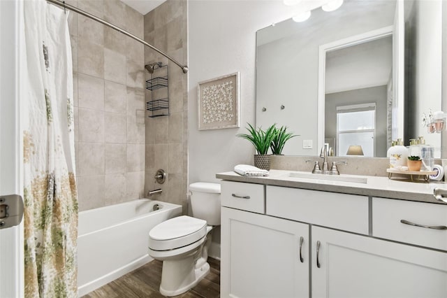 5226 Lake Venice Dr, Wimauma, FL 33598 - bathroom with vanity, toilet, shower / tub combo, and wood finished floors