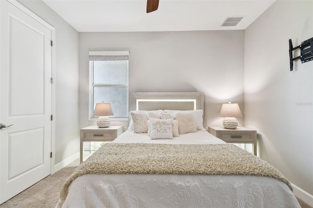 5226 Lake Venice Dr, Wimauma, FL 33598 - carpeted bedroom with visible vents, a ceiling fan, and baseboards