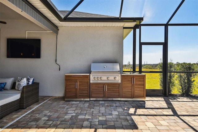 5226 Lake Venice Dr, Wimauma, FL 33598 - view of patio / terrace featuring a lanai, area for grilling, a grill, and a sink