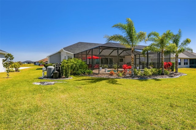 5226 Lake Venice Dr, Wimauma, FL 33598 - back of property with a residential view, glass enclosure, and a yard
