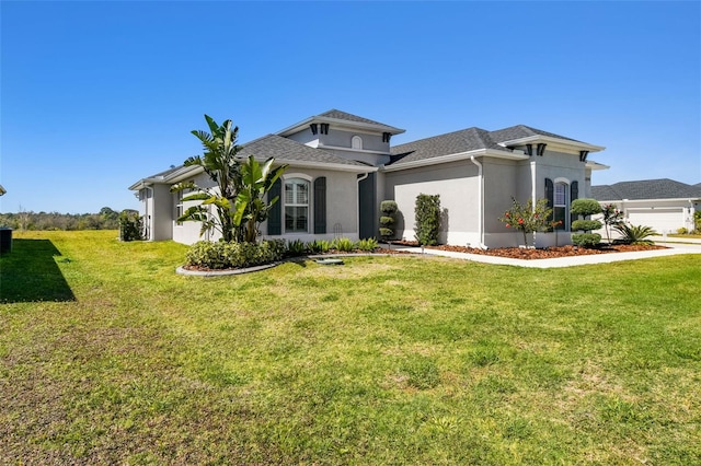 5226 Lake Venice Dr, Wimauma, FL 33598 - view of front of house featuring stucco siding, roof with shingles, and a front yard