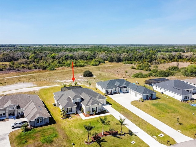 5226 Lake Venice Dr, Wimauma, FL 33598 - bird's eye view featuring a forest view