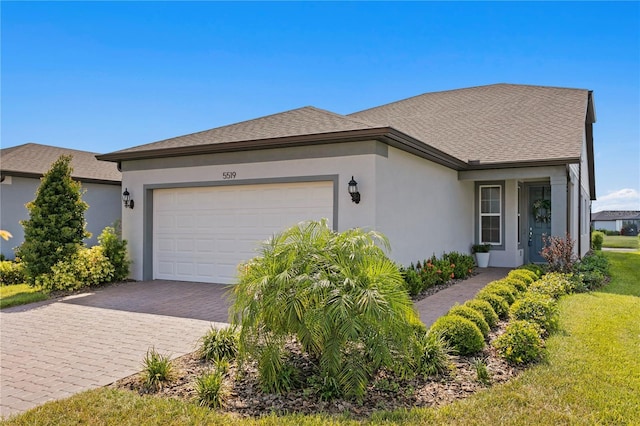 ranch-style house featuring a front yard and a garage