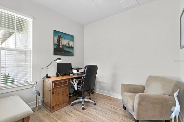 office featuring light hardwood / wood-style floors and a wealth of natural light