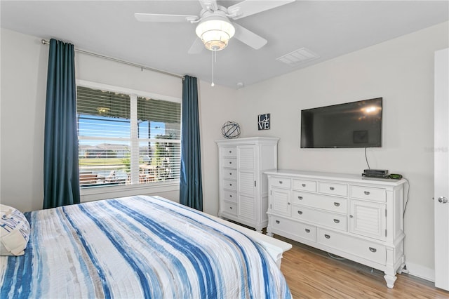 bedroom featuring light hardwood / wood-style floors and ceiling fan