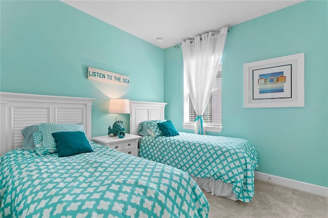 bedroom featuring light colored carpet