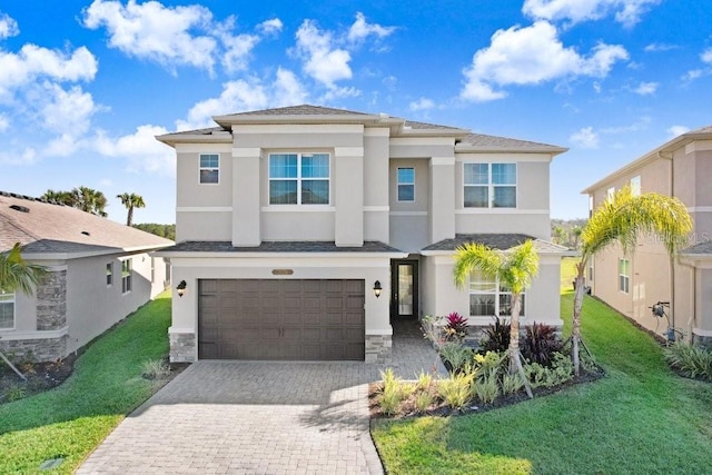 view of front facade with a front lawn and a garage