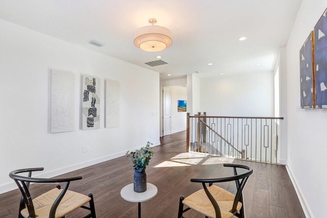 sitting room with dark hardwood / wood-style flooring