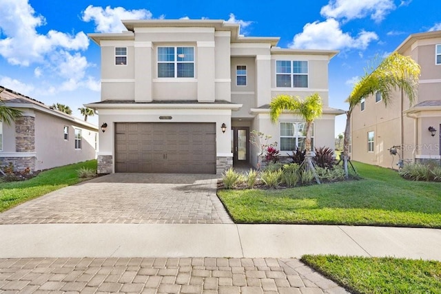 view of front of house featuring a front yard and a garage