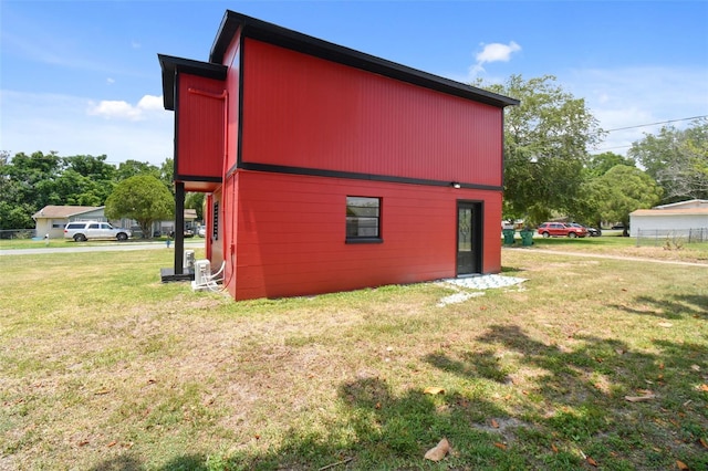 view of side of property with a yard