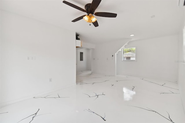 unfurnished living room with ceiling fan