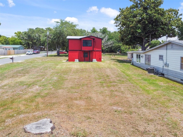 view of yard with central air condition unit