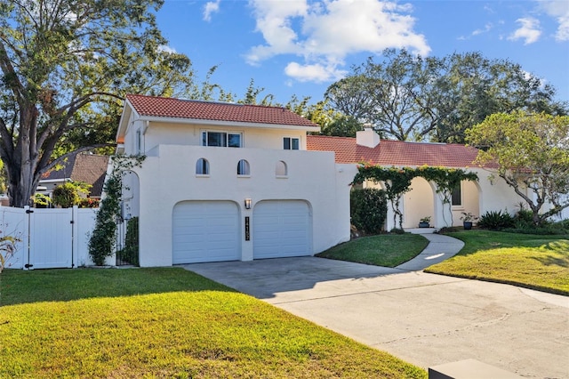 mediterranean / spanish-style house featuring a front lawn