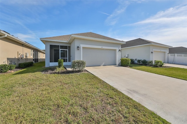 view of front of property with a garage and a front yard