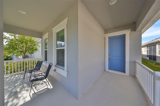 entrance to property featuring a porch