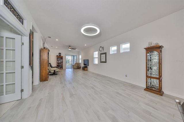 interior space featuring light wood-type flooring and ceiling fan