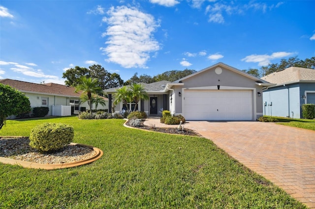 single story home featuring a front lawn and a garage