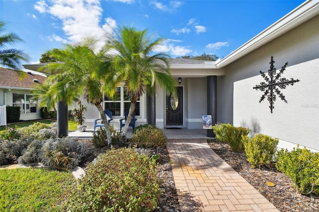 entrance to property featuring covered porch