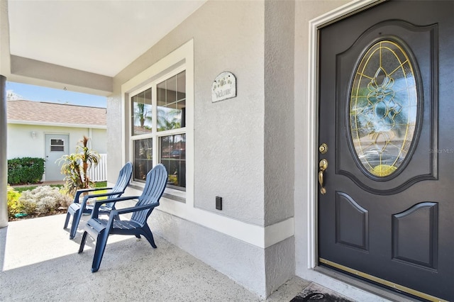 property entrance featuring covered porch