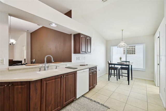 kitchen with light tile patterned flooring, dishwasher, hanging light fixtures, and sink