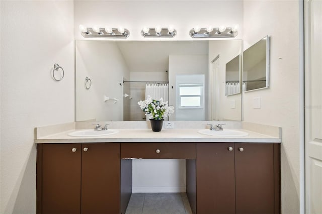 bathroom featuring tile patterned flooring, vanity, and a shower with shower curtain