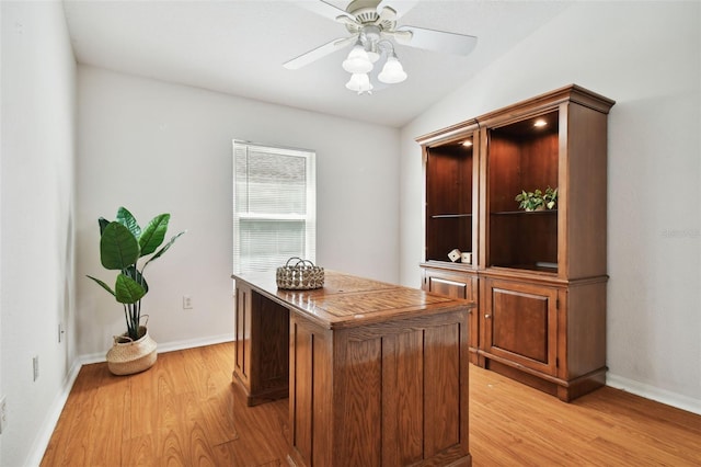 office space with ceiling fan, lofted ceiling, and light hardwood / wood-style floors