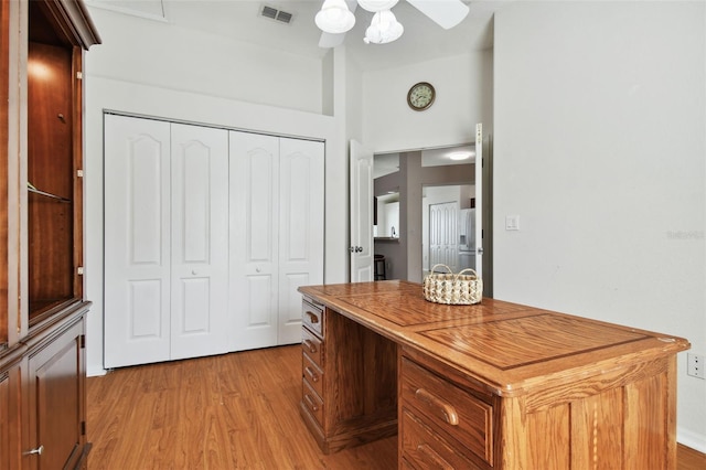 unfurnished office featuring ceiling fan and light hardwood / wood-style floors