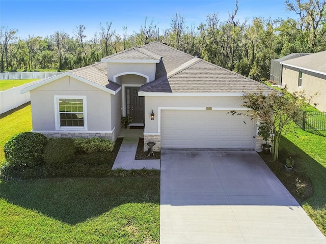 ranch-style home with a front lawn and a garage