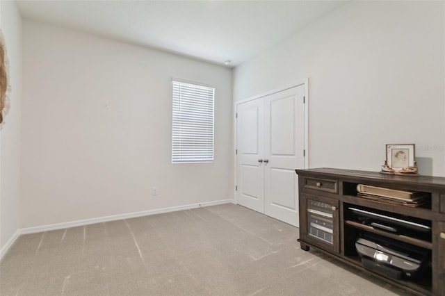 bedroom with light carpet