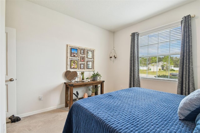 bedroom with light carpet