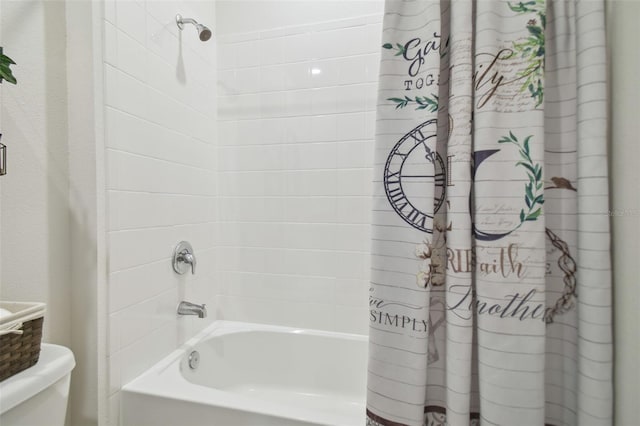 bathroom featuring shower / bathtub combination with curtain and toilet