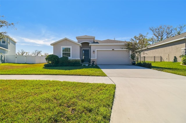 view of front of home featuring a garage and a front yard