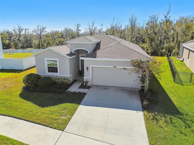 view of front of house with a garage and a front yard