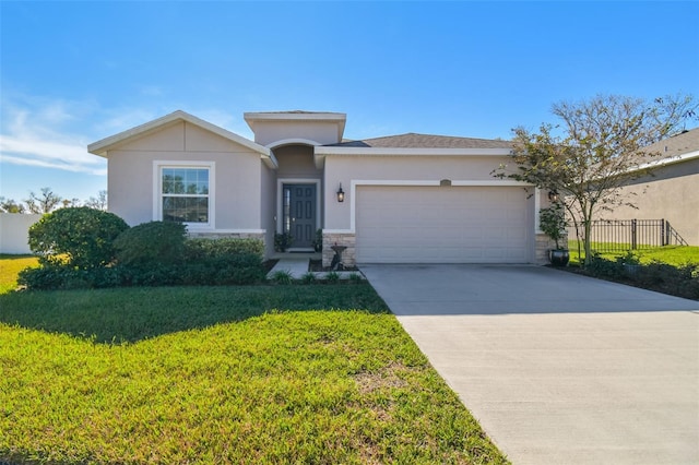 view of front of home featuring a garage and a front lawn