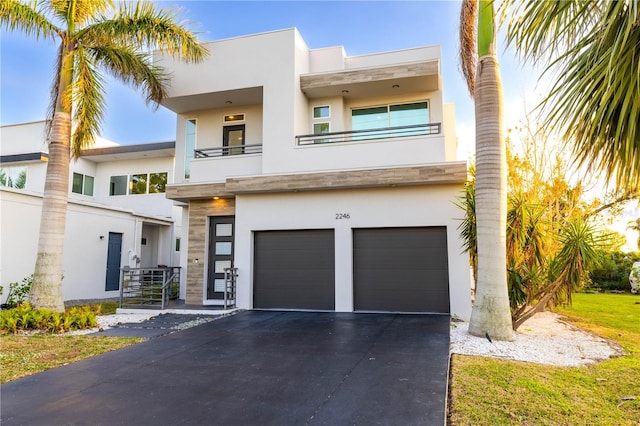 contemporary house with a balcony and a garage