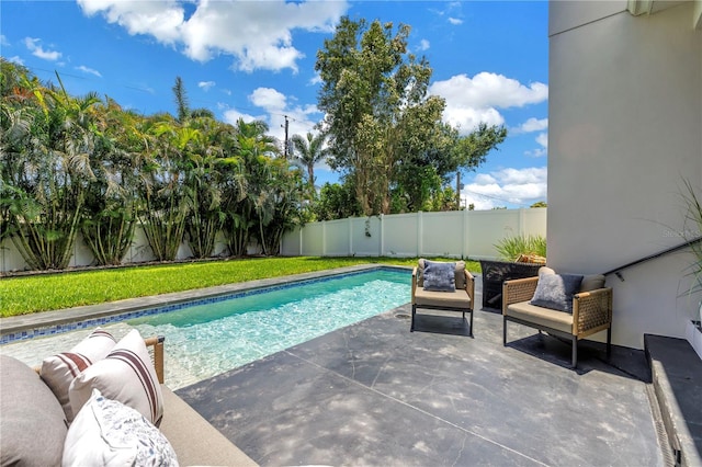 2246 Fiesta Dr, Sarasota, FL 34231 - view of swimming pool featuring a fenced backyard and a patio area