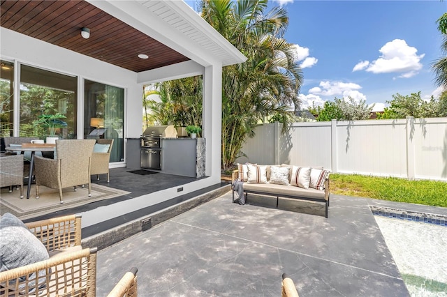 2246 Fiesta Dr, Sarasota, FL 34231 - view of patio / terrace with exterior kitchen, outdoor lounge area, and outdoor dining space