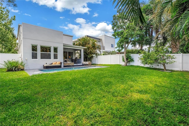 2246 Fiesta Dr, Sarasota, FL 34231 - rear view of house featuring a fenced backyard, outdoor lounge area, and stucco siding