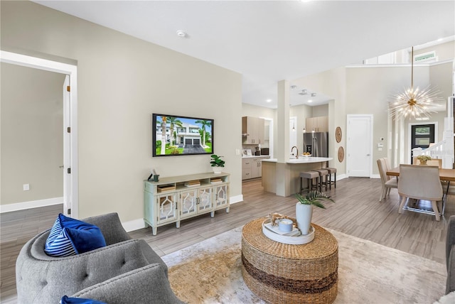 2246 Fiesta Dr, Sarasota, FL 34231 - living room with light wood finished floors and recessed lighting