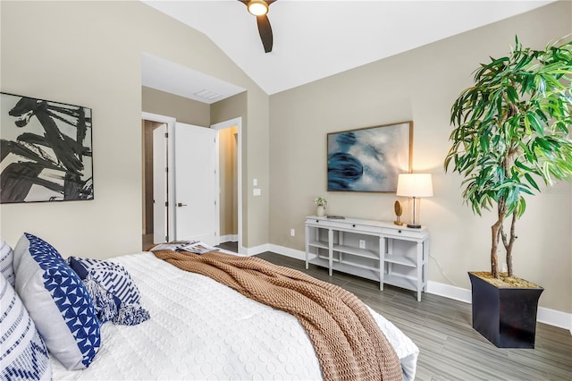 2246 Fiesta Dr, Sarasota, FL 34231 - bedroom with wood finish floors, lofted ceiling, and a ceiling fan