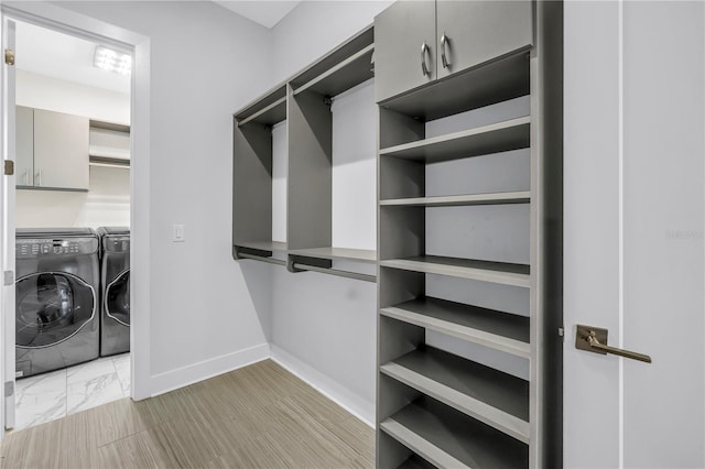 2246 Fiesta Dr, Sarasota, FL 34231 - walk in closet featuring independent washer and dryer