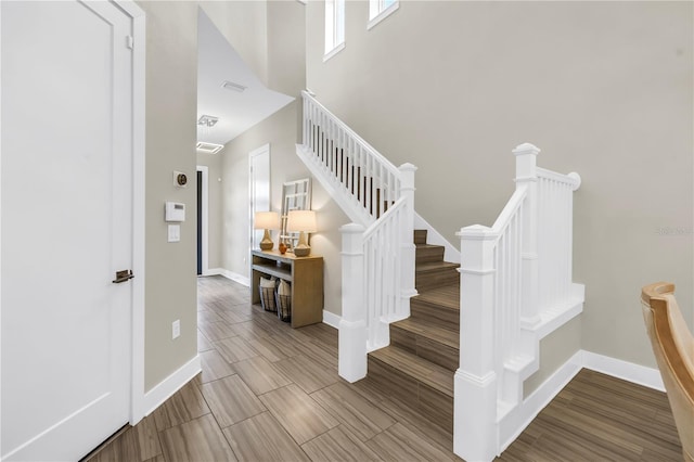 2246 Fiesta Dr, Sarasota, FL 34231 - staircase with baseboards and wood finish floors