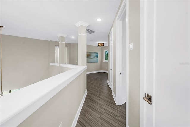 2246 Fiesta Dr, Sarasota, FL 34231 - hallway featuring dark wood-type flooring, recessed lighting, and ornate columns