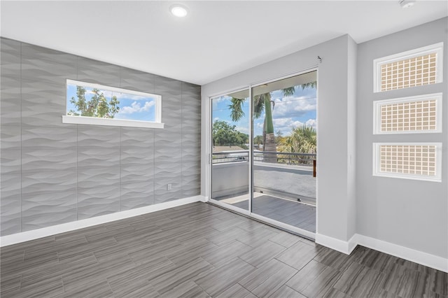 2246 Fiesta Dr, Sarasota, FL 34231 - spare room with recessed lighting and wood finish floors