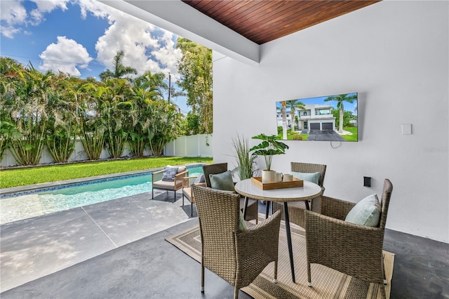 2246 Fiesta Dr, Sarasota, FL 34231 - fenced backyard featuring a patio area and outdoor dining area