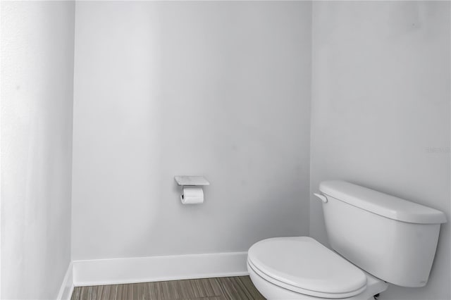 2246 Fiesta Dr, Sarasota, FL 34231 - bathroom featuring toilet and baseboards