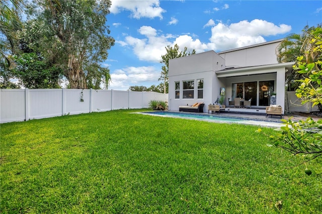 2246 Fiesta Dr, Sarasota, FL 34231 - back of house with a fenced backyard, a patio, and stucco siding