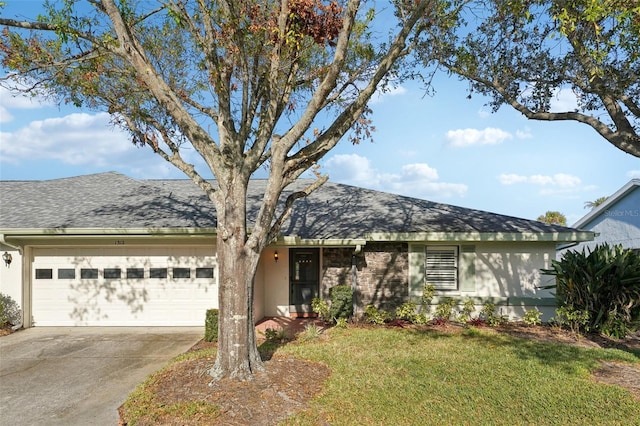 ranch-style house with a garage and a front yard